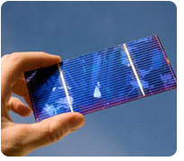 hand holding solar cell